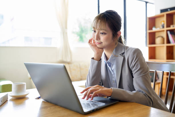 istock An Asian woman operating a computer with a troublesome look 1757451635
