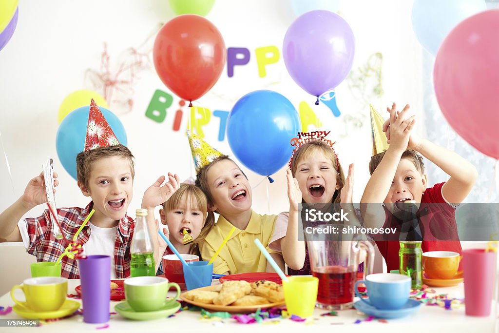Children at birthday party with colorful balloons Group of adorable kids having fun at birthday party Birthday Stock Photo