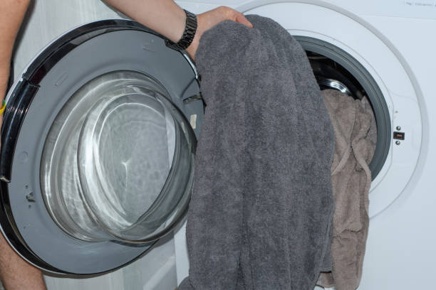 istock Throw laundry and dirty clothes into the washing machine 1757454773