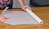 A roll of white paper unrolled for packaging