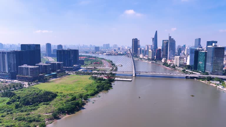 Aerial view of Ho Chi Minh city skyline with buildings, roads, bridge and Saigon river in Vietnam in the morning.