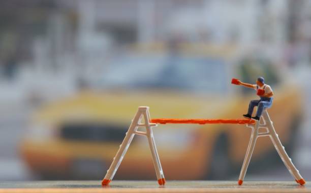Painter on ladder and New York taxi