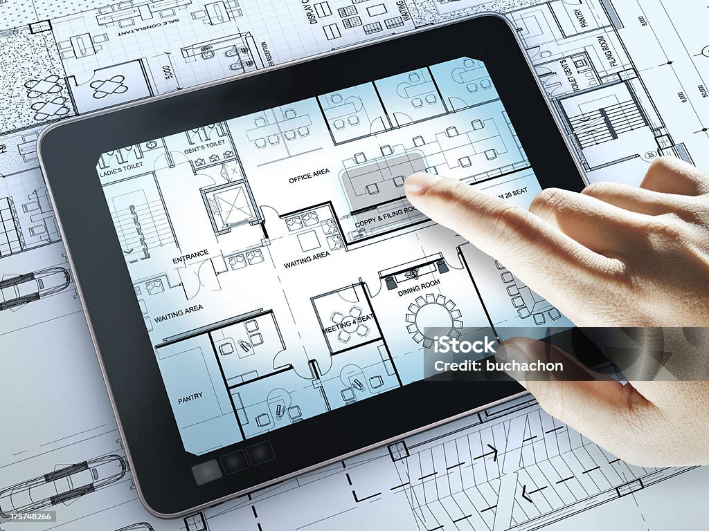 touch screen computer touch screen computer shows interior layout plan of office business Architect Stock Photo
