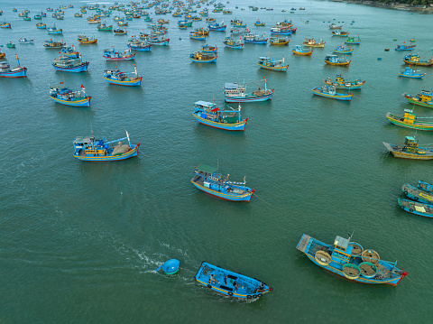 Drone view of fishing boats are nailing side by side La Gan beach, Phan Ri district, Binh Thuan province  central Vietnam