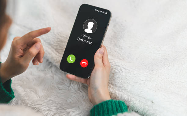 istock Human use smartphone with incoming call from unknown number, spam, prank caller, hoax person, fake identity, scammer, scam with mobile phone, hacker, call center, crime, call, fraud or phishing concept 1757501402