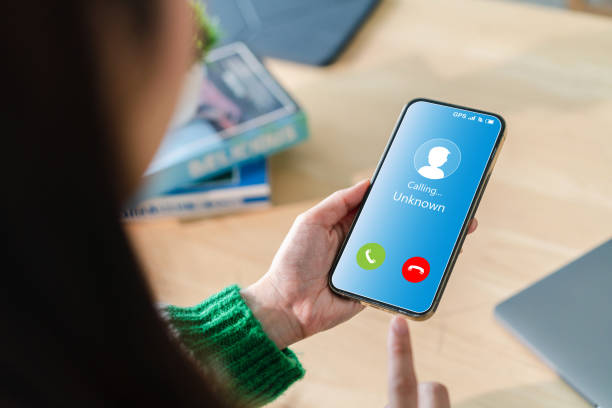 istock Human use smartphone with incoming call from unknown number, spam, prank caller, hoax person, fake identity, scammer, scam with mobile phone, hacker, call center, crime, call, fraud or phishing concept 1757501859