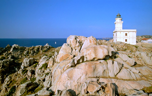 view of the lighthouse on the granite cliff against the sea of ​​the Strait of Bonifacio