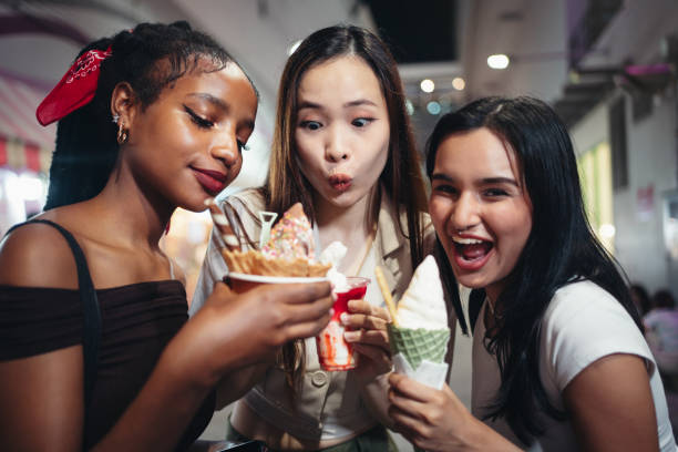 istock Three smiling friends with ice cream 1757541826