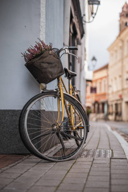 istock Old broken bicycle in the city against the wall 1757546341