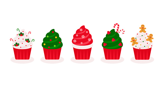 Christmas Cupcakes Set With Christmas Decoration. Cute Cupcakes With Mistletoes, Candy Canes And Sugar Sprinkles On White Background