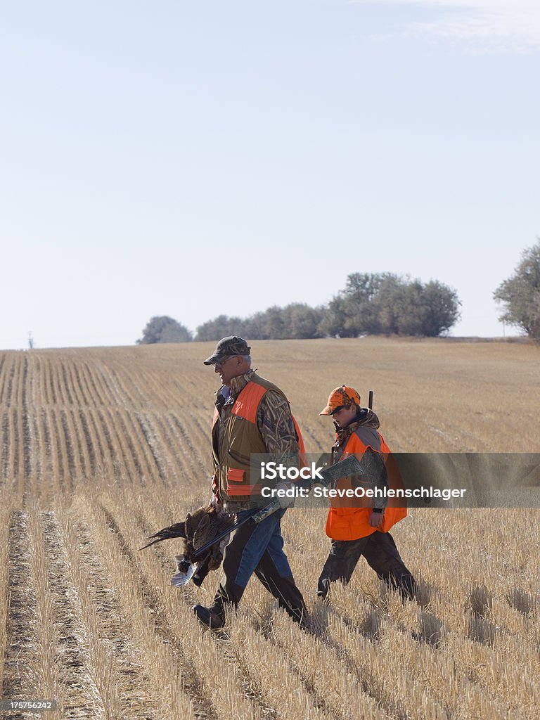 Grandpa and Grandson Hunting Grandpa and Grandson out Pheasant Hunting Hunting - Sport Stock Photo