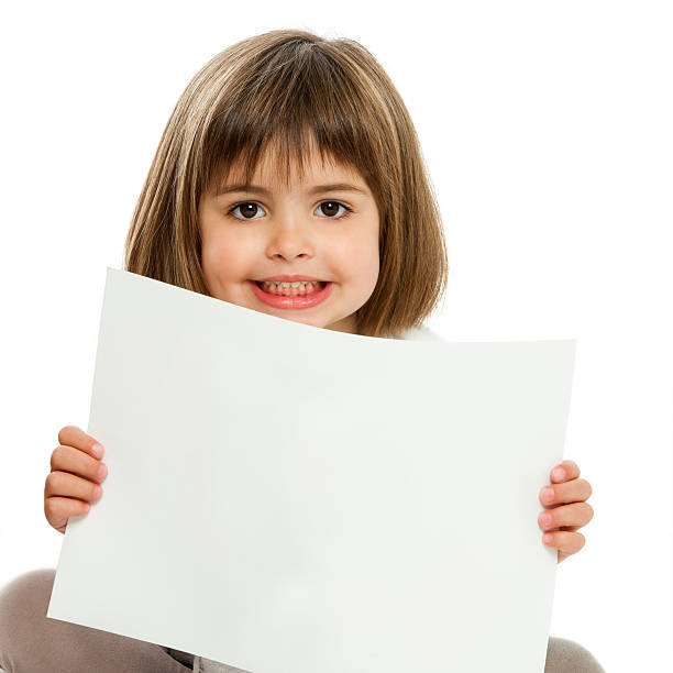 istock Cute little girl holding blank paper. 175757664