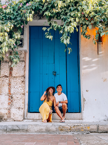 They discover places and villages in South America. Filipino young man and Argentinian young woman.