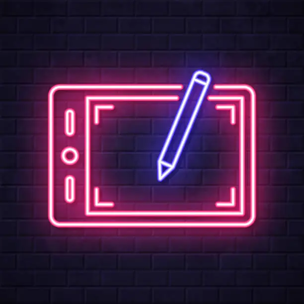 Vector illustration of Graphic tablet. Glowing neon icon on brick wall background