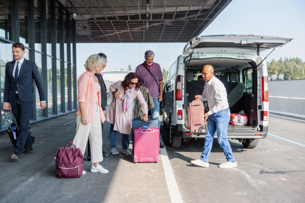 istock Mature Latin-American Van Driver Carrying A Passenger Suitcase 1757621561