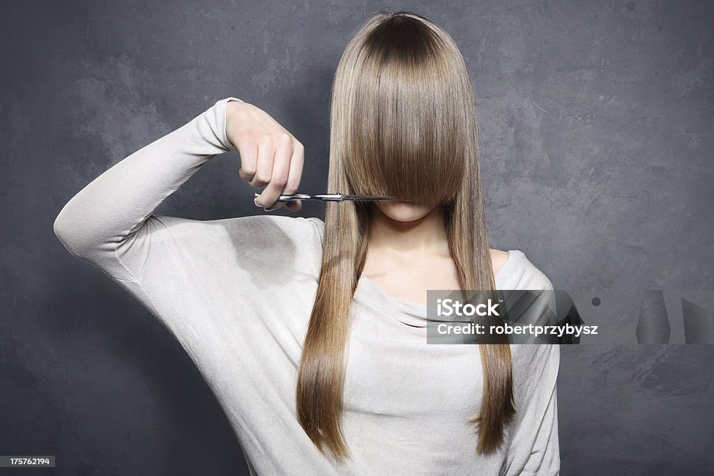 Girl with scissors Lovely girl decided to get a haircut Cutting Stock Photo