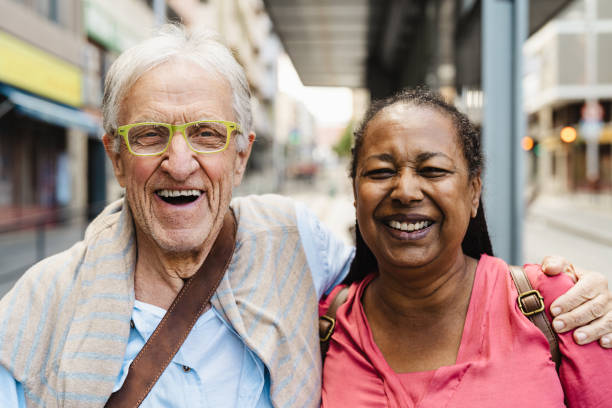 istock Happy multiracial senior friends having fun while waiting at the bus station 1757645404