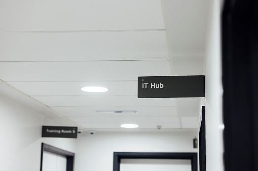 Close up of an empty hospital training facility corridor in Newcastle, England. There is an information sign that reads 