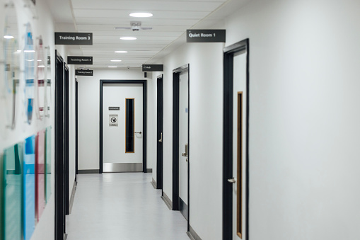 Full length of an empty hospital training facility corridor in Newcastle, England.