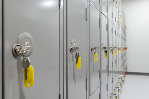 Close up of storage lockers in a row with keys hanging in the locks at a hospital in Newcastle, England.