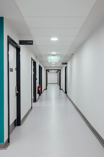 Full length of an empty hospital training facility corridor in Newcastle, England.