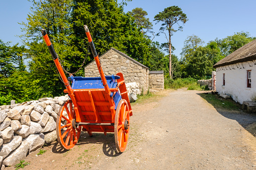 Horse drawn cart in the yard of an old Irish farm