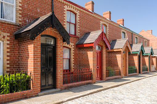 A street of townhouses, traditionally built in Victorian Belfast to accommodate workers in factories and mills.