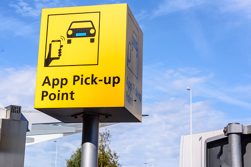 Sign for the App pick-up point, Schiphol Airport, Netherlands