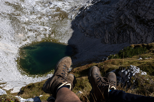 Hiking Pair rest near Kriski Podi middle lake - Julian Alps Slovenia