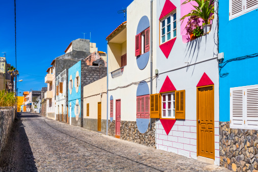 alley with typically colorful house facades on Vila das Pombas - village of Santo Antao / Cape Verde