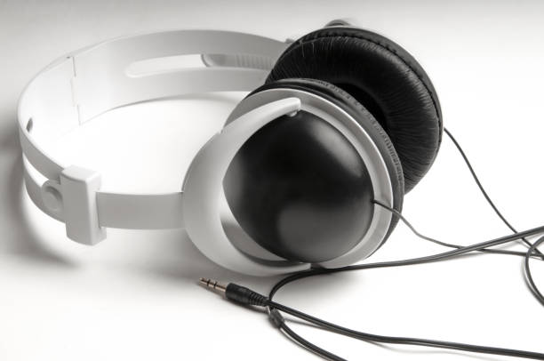 istock Black and white headphones on a white background. 1757689931