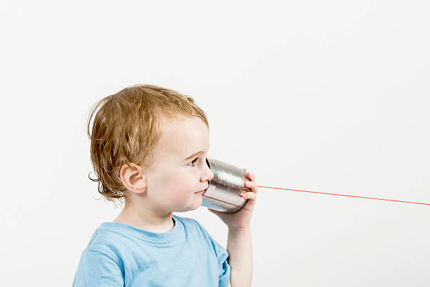 istock young child with tin can phone 175769982