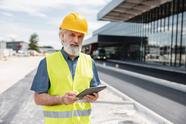 istock Cheerful Mature Caucasian Male Employee Working In A Construction Site 1757714485