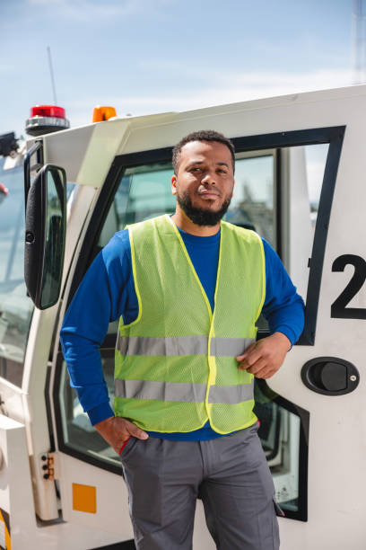 istock Hispanic Airport Worker Leaning On A Pushback Tug On A Runway 1757717769