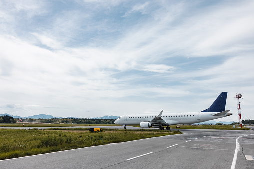 Traffic at the airport. Airplane is taxiing to the runway.