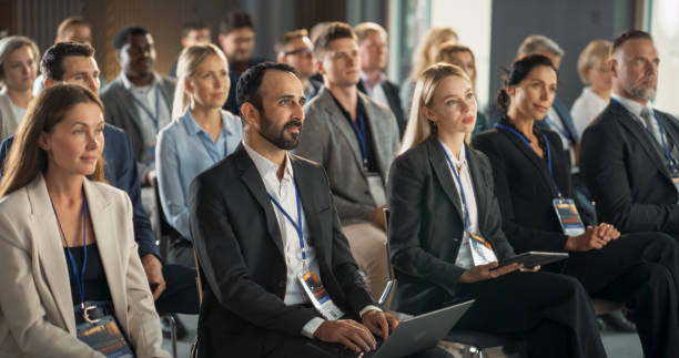 istock Diverse Biopharma Entrepreneurs Sitting In Crowd At International Medical Summit, Using Laptops, Tablets To Take Notes. Male And Female Industry Leaders Listening To Presentation About Biotechnology. 1757739762