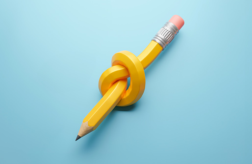 Pencil knot. A pencil tied in a knot on a blue background.