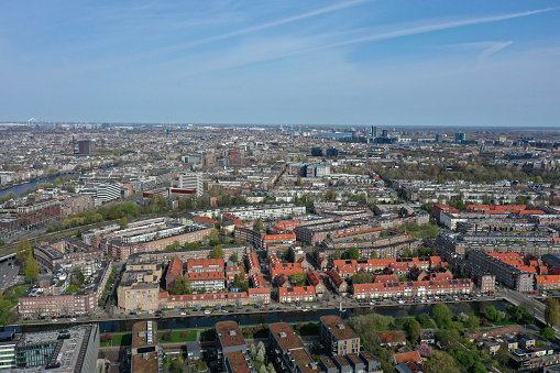 Amsterdam panoramic view. Amsterdam is the capital and most populated city of the Netherlands. The image shows the beautiful city as wide angle panorama, captured during spring season.