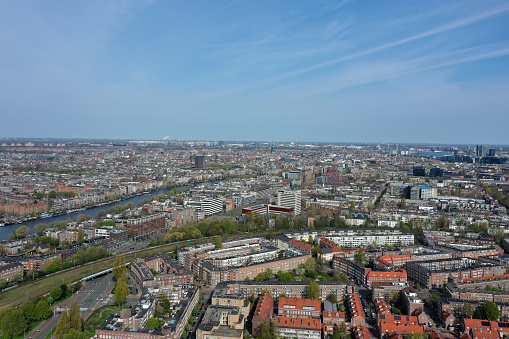 Amsterdam panoramic view. Amsterdam is the capital and most populated city of the Netherlands. The image shows the beautiful city as wide angle panorama, captured during spring season.