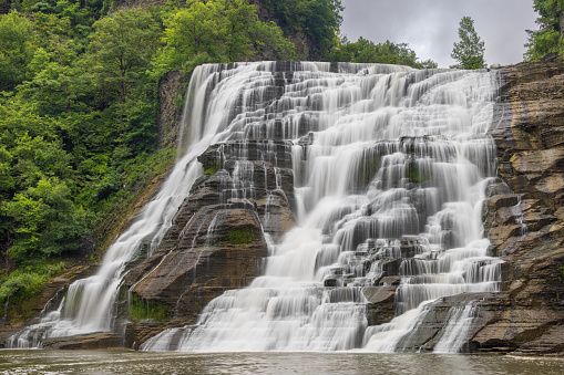 A vertical shot of Salt Creek Falls flowing down steep rocky hill in Willamette National Forest