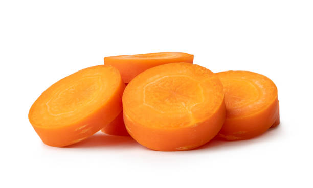 istock Beautiful orange  carrot slices in stack isolated on white background with clipping path. 1757774810