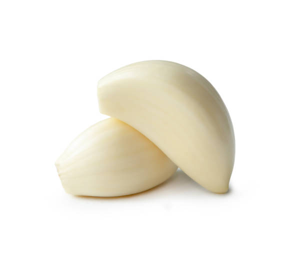 istock Peeled garlic cloves in stack isolated on white background with clipping path 1757775114