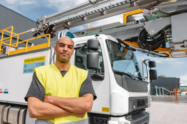 istock Latin-American Man Standing In Front Of A Deicing Truck 1757778146