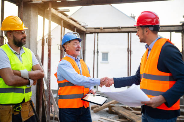 istock Caucasian architect handshake with building contractor at the construction site 1757789315