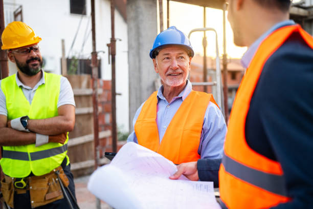 istock Caucasian architect, building contractor and engineer, having an meeting on a construction site 1757789550