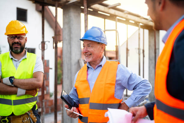 istock Caucasian architect, building contractor and engineer, having an meeting on a construction site 1757789730