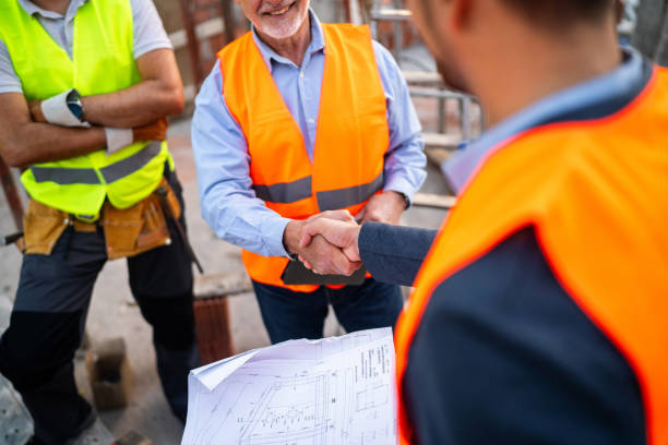 istock Unrecognizable Caucasian architect handshake with building contractor at the construction site 1757789767