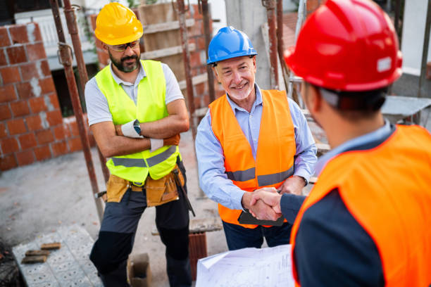 istock Caucasian architect handshake with building contractor at the construction site 1757789769