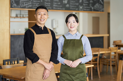 Asian couple running a cafe