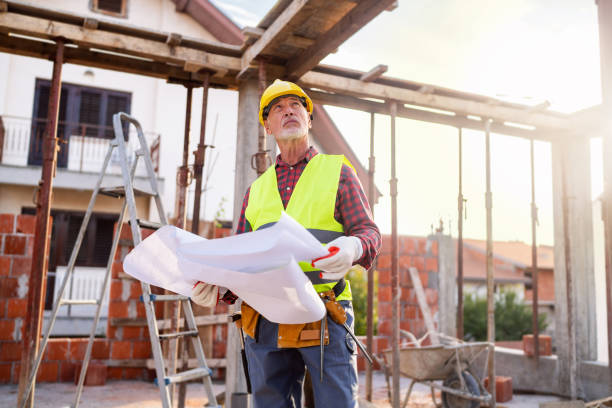 istock Senior Caucasian male architect observing the work in project on a construction site while holding blueprint 1757793678